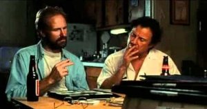 Auggie (Harvey Keitel) shows his photo album to his friend